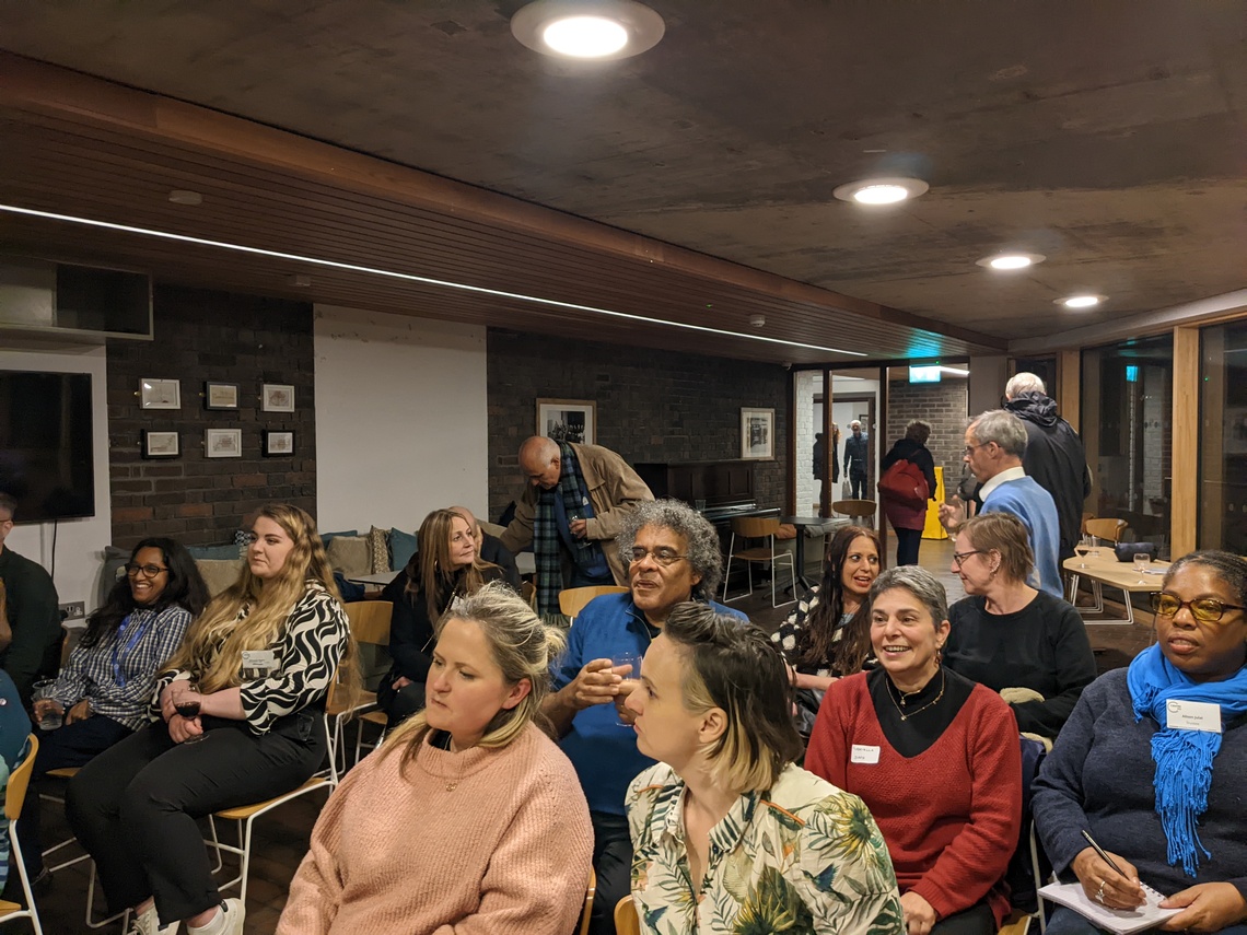 People sitting at formal AGM meeting