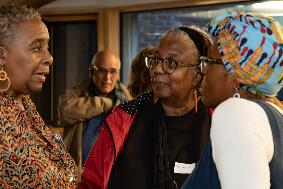 3 women in close conversation