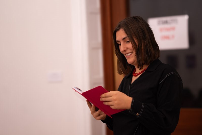 Woman reading from Maternal Journal